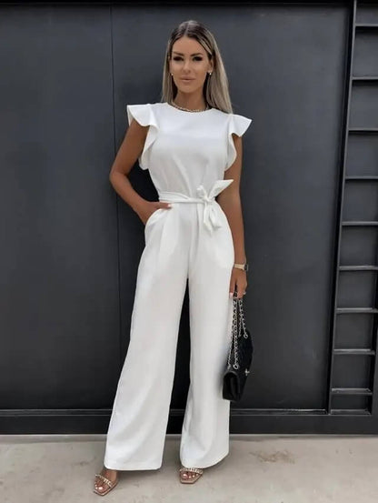Noélia - Maxi-Overall aus Satin mit kurzen Ärmeln, welligen Schultern, Stehkragen, Taillengürtel und weitem Hosenbein
