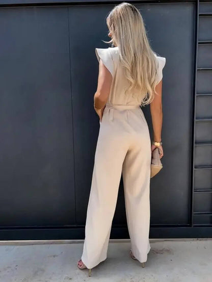 Noélia - Maxi-Overall aus Satin mit kurzen Ärmeln, welligen Schultern, Stehkragen, Taillengürtel und weitem Hosenbein