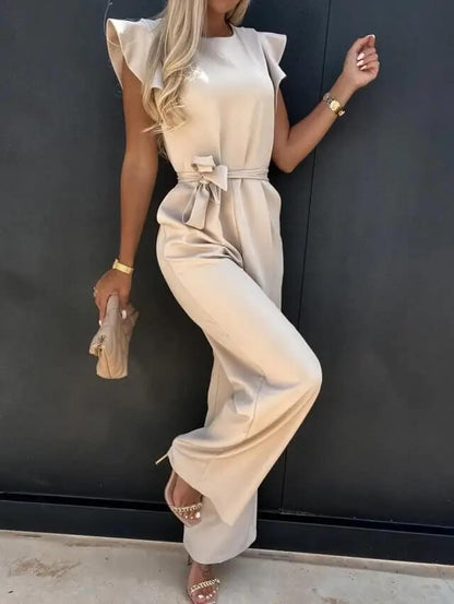Noélia - Maxi-Overall aus Satin mit kurzen Ärmeln, welligen Schultern, Stehkragen, Taillengürtel und weitem Hosenbein
